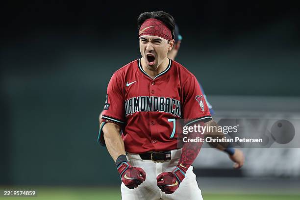 Corbin Carroll of the Arizona Diamondbacks reacts after hititng a triple against the Seattle Mariners during the sixth inning of the MLB game at...