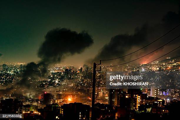 Smoke rises from locations targeted in Tehran amid the third day of Israel's waves of strikes against Iran, on Sunday, June 15, 2025.