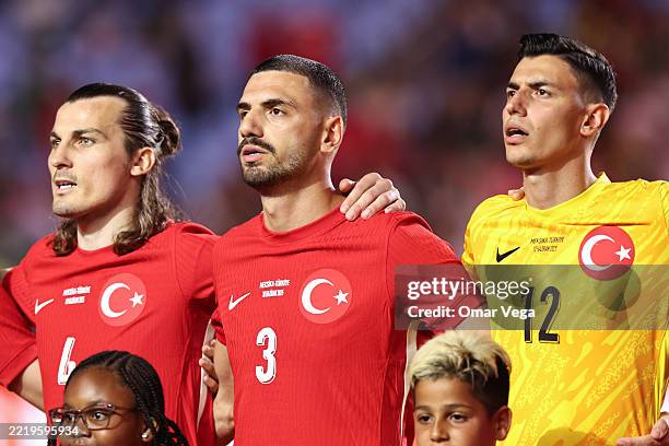 Çalar Söyüncü, Merih Demiral and Berke Özer of Turkey stand for they national anthem before to the international friendly match between Mexico and...