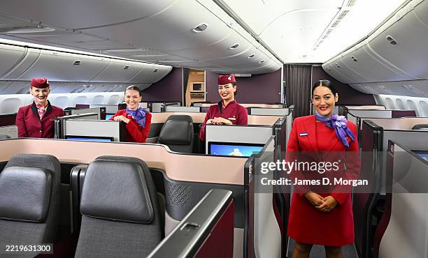 In this image released on 11 June, Virgin Australia and Qatar Airways cabin crew are pictured together ahead of the launch of Virgin Australia's...