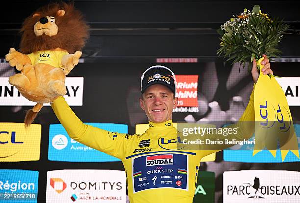 Remco Evenepoel of Belgium and Team Soudal Quick-Step celebrates at podium as Yellow leader jersey winner during the 77th Criterium du Dauphine 2025,...