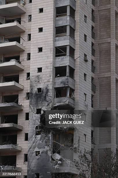 This photo shows a general view of a damaged building following a strike by an Iranian missile in the Israeli city of Petah Tikva, east of Tel Aviv,...