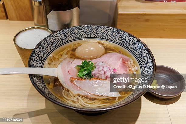 light flavor alfonsino ramen noodle (japanese ramen noodles made with sea bream broth),
also topped with a half-boiled egg. - izakaya food stock pictures, royalty-free photos & images