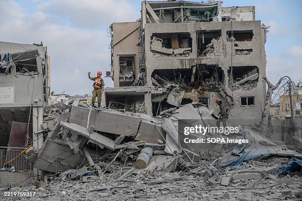 Home Front Command and Medics are looking for casualties in a private house destroyed by a direct hit in Bnei Brak following an Iranian ballistic...