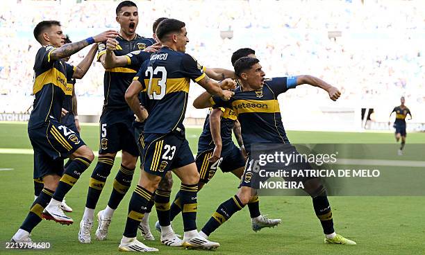 Boca Juniors' Uruguayan forward Miguel Merentiel celebrates with teammates after scoring his team's first goal during the FIFA Club World Cup 2025...