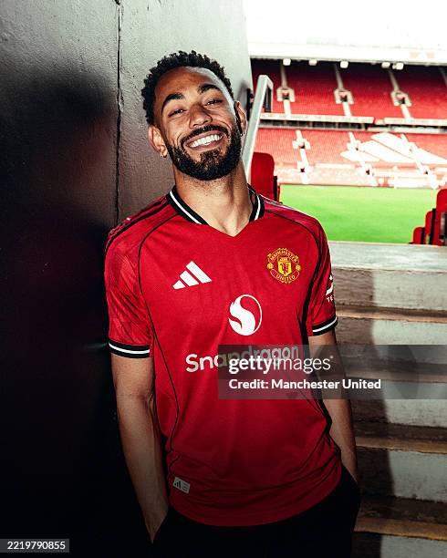 Matheus Cunha of Manchester United poses for a photo after signing his contract with the club at Old Trafford on June 12, 2025 in Manchester, England.