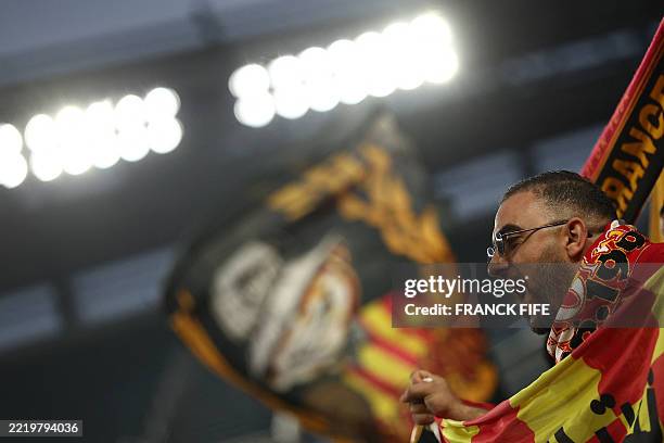 Fan of Esperance Sportive de Tunis cheers for his team ahead of the FIFA Club World Cup 2025 Group D football match between Brazil's CR Flamengo and...