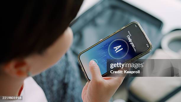 asian woman talking with ai on phone - speech recognition stock pictures, royalty-free photos & images