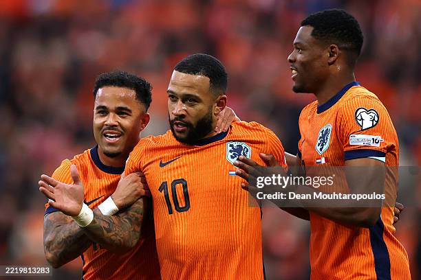 Memphis Depay of Netherlands celebrates scoring his team's second goal with teammates Justin Kluivert and Denzel Dumfries during the FIFA 2026 World...