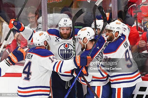 Leon Draisaitl of the Edmonton Oilers celebrates with teammates after scoring during overtime to beat the Florida Panthers 5-4 in Game Four of the...