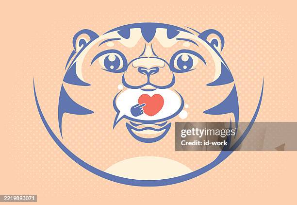 kitten holding speech bubble with heart sign - cat looking at camera stock illustrations