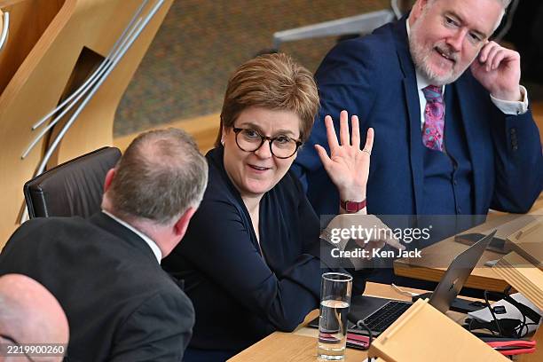Former First Minister Nicola Sturgeon shares a lighter moment with colleagues during the Stage 3 debate on the Scottish Languages Bill in the...
