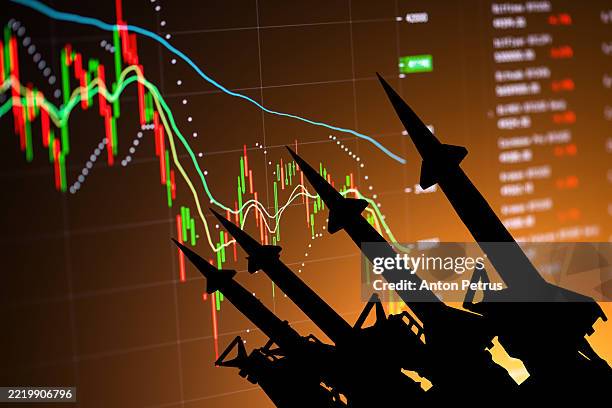 missiles on the background of economic data. economic crisis due to war - guerra civil imagens e fotografias de stock