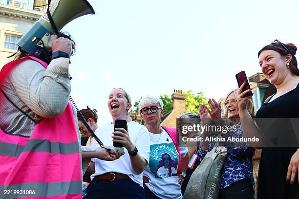 Protesters from pro-choice group 'Abortion Rights' react as they gather near Parliament, after MPs voted to decriminalise abortion on June 17, 2025...