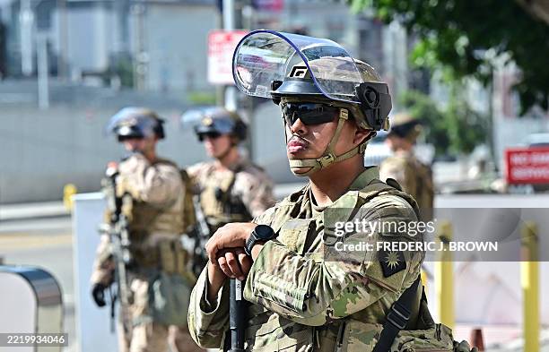 Members of the California National Guard stand watch in front of the Edward Roybal Federal Building on the morning of June 17, 2025 in Los Angeles,...