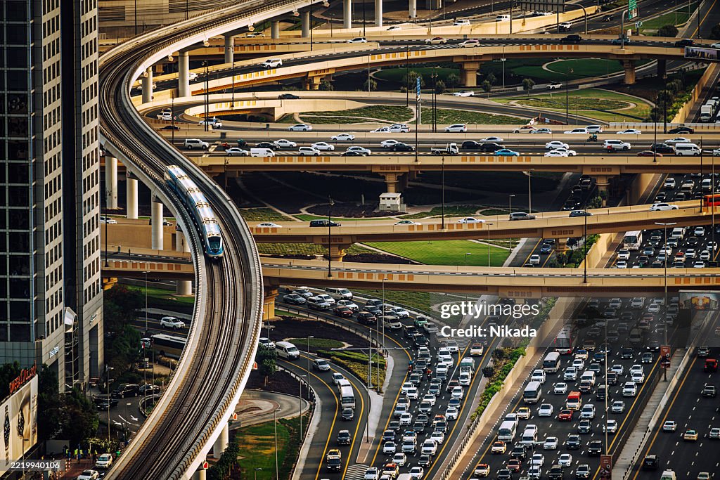 Dynamic Aerial View of Sheikh Zayed Road Traffic and Metro in Dubai