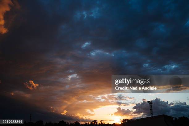 vibrant sunset clouds orange and purple - alsace nature stock pictures, royalty-free photos & images