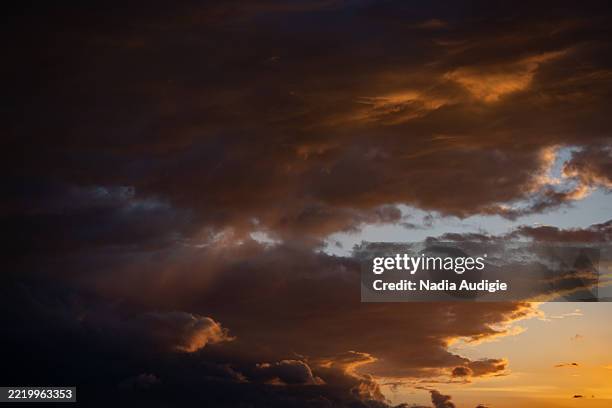 vibrant sunset clouds orange and purple - alsace nature stock pictures, royalty-free photos & images