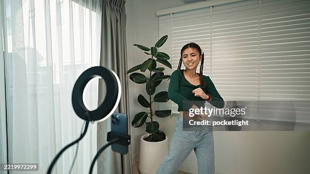 influencer girl having fun dancing. - live stream dance stock pictures, royalty-free photos & images
