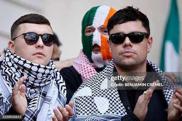 Irish rap group Kneecap singer, Liam O'Hanna , who performs under the stage name Mo Chara, stands with band mates Naoise O Caireallain, aka Moglai...