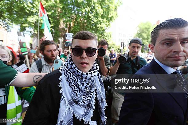 Liam Óg Ó hAnnaidh, who performs under the name Mo Chara of Irish group Kneecap is seen departing Westminster Magistrates' Court on June 18, 2025 in...