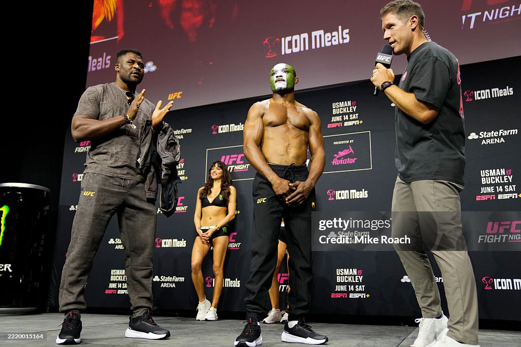 Usman Rind Kamaru Usman of Nigeria is seen on stage with Francis Ngannou during ...