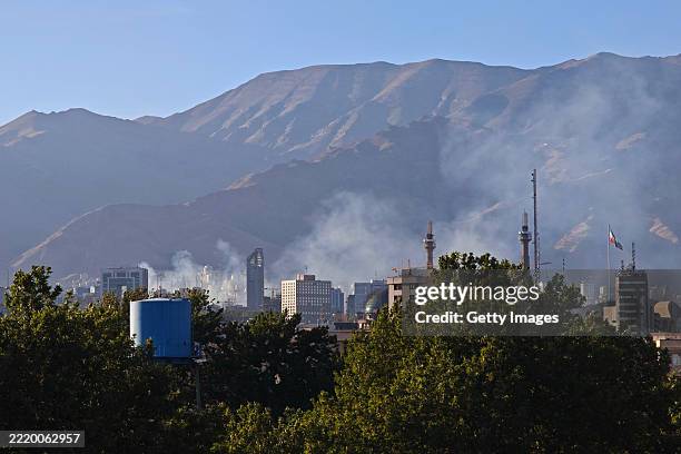Smoke rises after a reported Israeli strike on Tehran police headquarters on June 18, 2025 in Tehran, Iran. Over recent days, Iran has been hit by a...