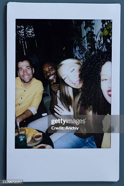 polaroid photos of friends dinning out - instant camera stock pictures, royalty-free photos & images
