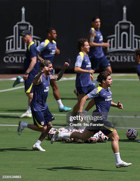 Julian Alvarez of Atletico de Madrid in action as Rodrigo De Paul celebrates during the Training/Press Conference ahead of their FIFA Club World Cup...