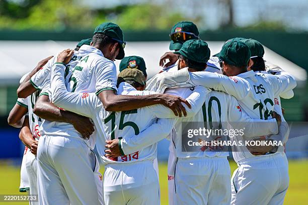 Bangladesh's players huddle before the start of Sri Lanka's first inning during the third day of the first Test cricket match between Sri Lanka and...