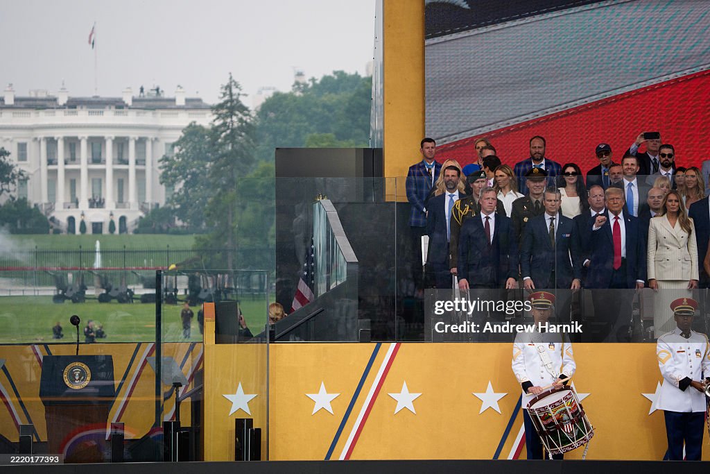 President Parade President Donald Trump gestures during a military parade alongside ...