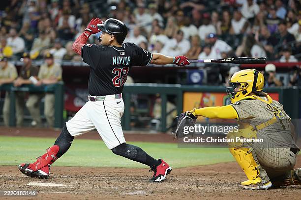 Josh Naylor of the Arizona Diamondbacks hits the game-winning fielder's choice during the ninth inning of the MLB game against the San Diego Padres...