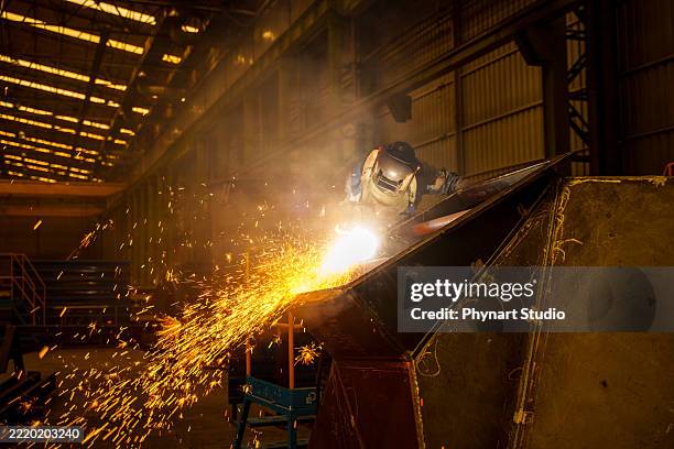 industrial welder with torch - steel mill stock pictures, royalty-free photos & images