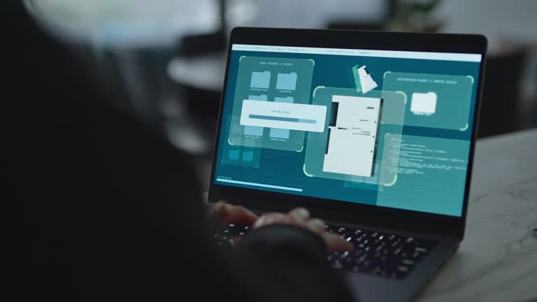 https://media.gettyimages.com/id/2220206816/video/hacker-using-laptop-computer-copying-files-and-secret-documents-in-remote-server.jpg?b=1&s=640x640&k=20&c=V0txCmPlKoUEJ8ZM2TKYs6escQNrTHZd0jfdoi2Dg-o=