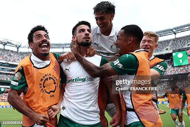 Palmeiras' Argentine forward Jose Manuel Lopez celebrates scoring his team's second goal with teammates during the FIFA Club World Cup 2025 Group A...