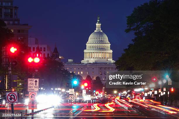 In a long exposure photo, the U.S. Capitol Building is seen at dusk as vehicles travel on Pennsylvania Avenue on June 18, 2025 in Washington, DC.