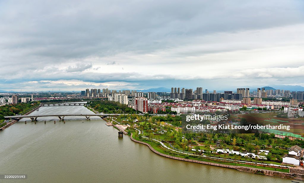 View of Jinhua City and Yiwu River on an overcast day, Jinhua City, Zhejiang Province, China