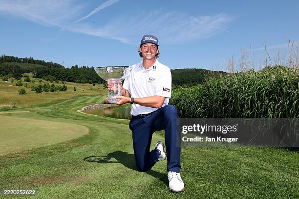 Palmer Jackson of United States poses with the winners trophy following victory on day four of the Raiffeisenbank Golf Challenge 2025 at Kaskáda Golf...