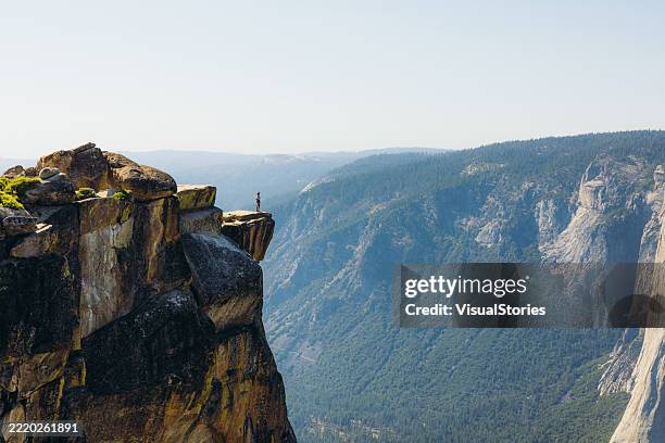 person admiring vast awe panoramic landscape of yosemite valley from above - half dome stock pictures, royalty-free photos & images