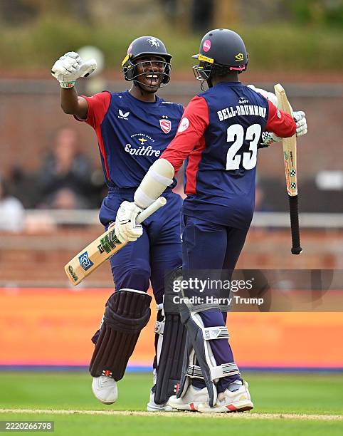 Daniel Bell-Drummond of Kent Spitfires celebrates their century with team mate during the Vitality Blast Men match between Somerset and Kent...