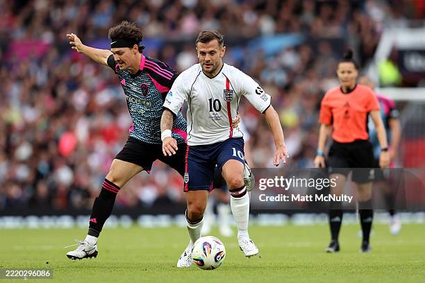 Jack Wilshere of England battles for possession with Noah Beck of World XI during Soccer Aid 2025 at Old Trafford on June 15, 2025 in Manchester,...