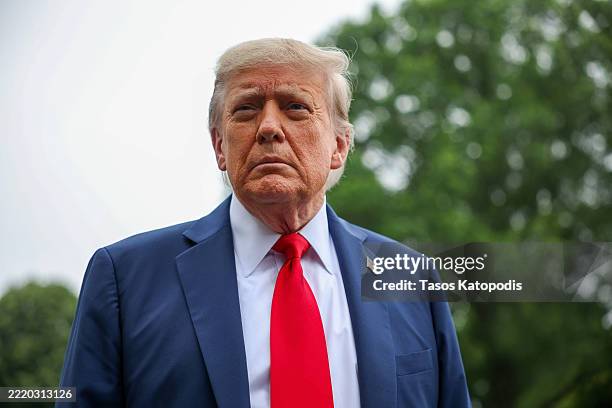 President Donald Trump stops and talks to the media before he boards Marine One on the South Lawn at the White House on June 15, 2025 in Washington,...