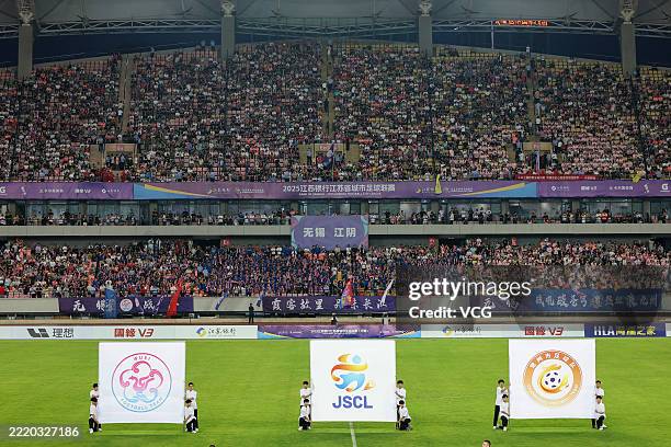 Performance is staged prior to a match between Team Wuxi and Team Changzhou during fourth-round of the Jiangsu Football City League, affectionately...