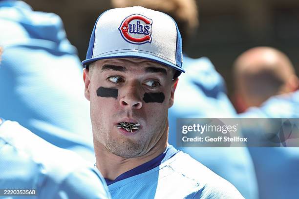 Matt Shaw of the Chicago Cubs stands in the dugout with a mouthful of sunflower seeds before a game against the Seattle Mariners at Wrigley Field on...