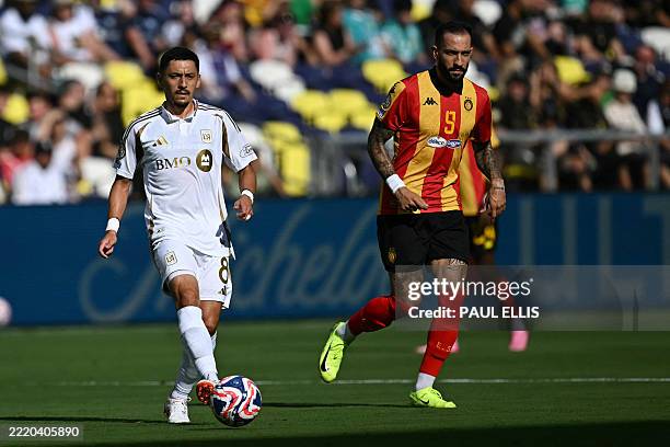S US midfielder Marky Delgado and Esperance's Brazilian forward Rodrigo Rodrigues fight for the ball during the FIFA Club World Cup 2025 Group D...