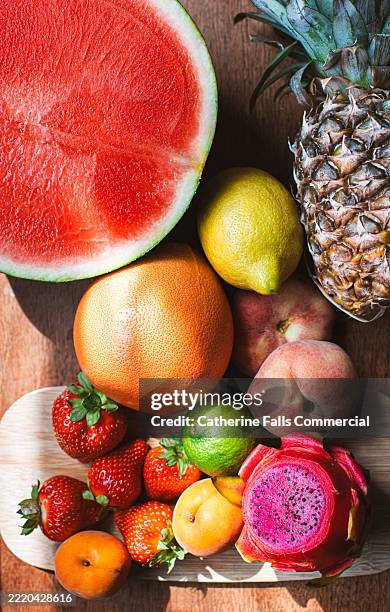 top down image of colourful, ripe fruits - dragon fruit stock pictures, royalty-free photos & images