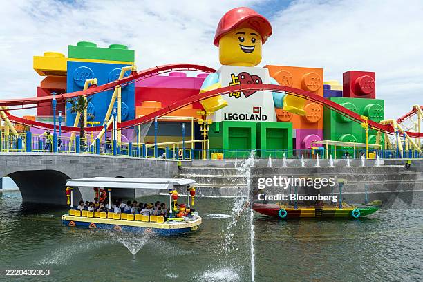 Visitors ride a boat ride during a media preview at Legoland Shanghai Resort in Shanghai, China, on Friday, June 20, 2025. The resort will officially...