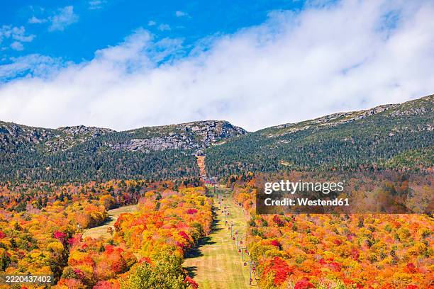 scenic view of mount mansfield with autumn foliage and gondola skyride at stowe mountain resort in vermont, usa - vermont stock pictures, royalty-free photos & images
