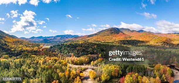Aerial view of the Adirondack Mountain Range and Ausable River in Keene Valley, New York during autumn Aerial view of the Adirondack Mountain Range and Ausable River in Keene Valley, New York during autumn