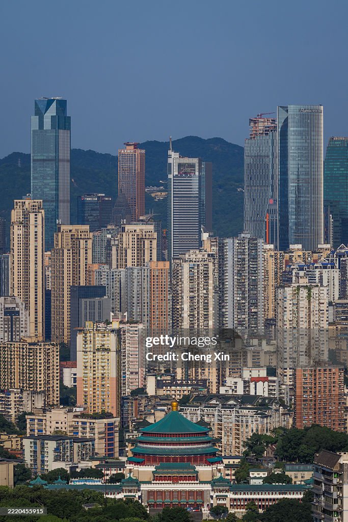 Chongqing People's Auditorium Amid Dense Urban High-Rises